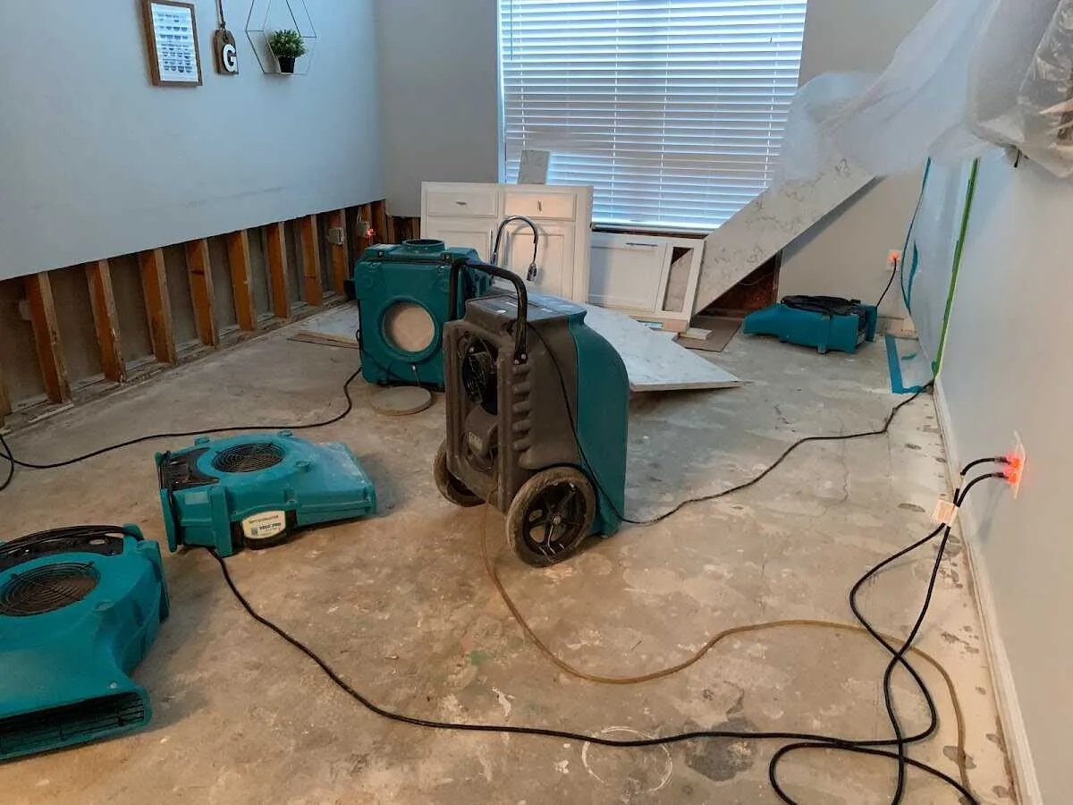 Dehumidifier in flood-cut room for Water Damage Restoration in Lamont